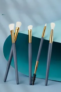 Detailed view of a 5-piece blue eye makeup brush set with soft white fibers