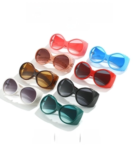Matrix display of Y2K round oversized sunglasses in multiple vibrant colors on white background