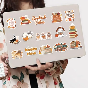 Detail of waterproof autumn bookish stickers on laptop showing fall reading vibes