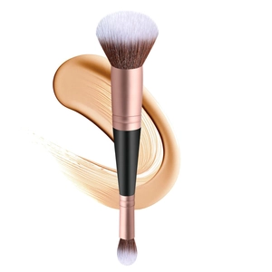 Dual-ended makeup brush detail with large fluffy foundation head and small concealer bristles