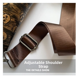Detail of adjustable nylon shoulder strap with gunmetal buckle and skull texture