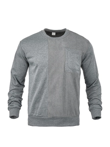 Detail of vertical panel stitching and chest pocket on dark gray crewneck sweatshirt
