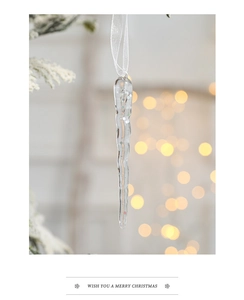 Macro shot of a spiral acrylic Christmas icicle pendant with colorful glitter highlights