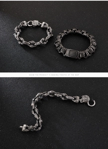Close-up of vintage titanium steel men bracelet featuring geometric textures and dark finish