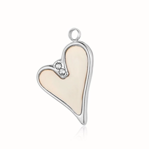 Detailed view of silver heart pendant with cream enamel inlay and crystal accents