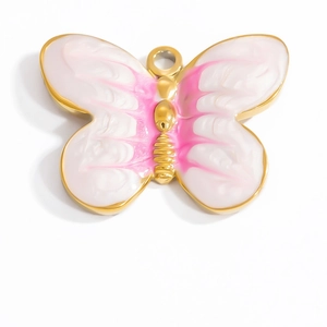 Detailed view of butterfly pendant with pink enamel gradient and 18K gold-plated frame