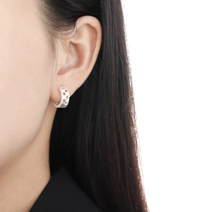 Minimalist matte S925 silver hollow square grid earrings shown on a model