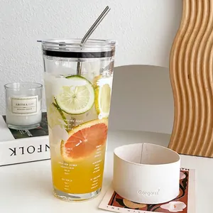 Large capacity glass tumbler with white leather sleeve and straw for coffee or tea