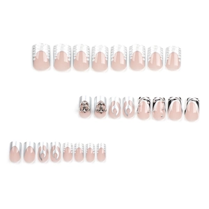 Gothic style nude press-on nails with silver 3D cross, flame art and wave designs