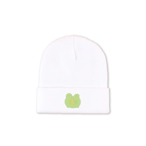 Detailed close-up of a white knitted beanie featuring a cute green frog star embroidery