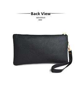Detail view of the black pebble leather back display with golden zipper and wrist strap