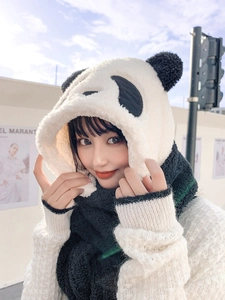Close-up of the plush panda-shaped hood and scarf combo with fluffy faux fur texture