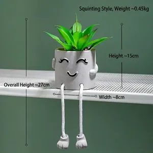 Modern cement faux succulent planter with hanging rope legs and a cute smiling face