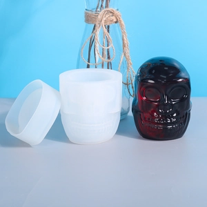 DIY silicone skull storage box mold showing mold parts and finished glossy resin jar