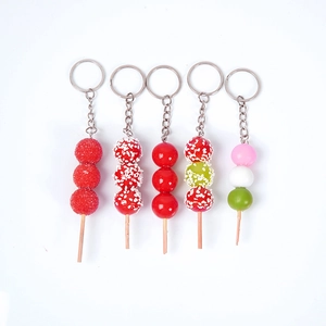 Miniature food keychains featuring detailed candied hawthorns and colorful dango sticks