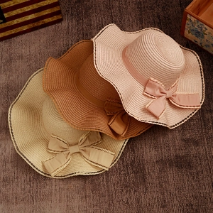 Women's wavy brim straw sun hat with ribbon bow and lace trim in three elegant colors