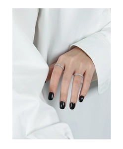 Close-up of minimalist S925 sterling silver rings with pavé cubic zirconia setting