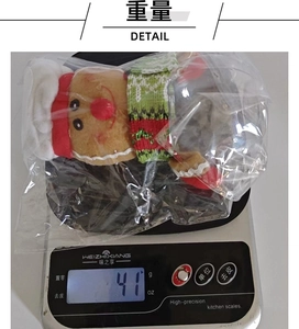 Christmas gingerbread man storage jar with red hat weighing 41g on a digital scale