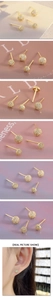 Detailed view of luxury gold round stud earrings with shimmering pave-set cubic zirconia