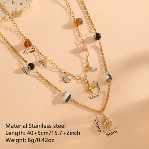 18K gold plated stainless steel layered necklace with conch, cross, and eye charms