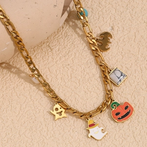Detail of 18K gold-plated Halloween necklace with ghost, pumpkin and bat charms