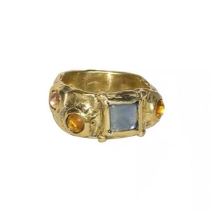 Retro gold-toned ring featuring a square blue stone and amber accents on white background