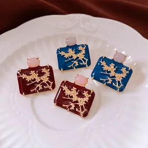 Vintage enamel quadrilateral plum blossom earrings in deep red and navy blue tones