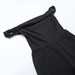 Detailed view of the black off-shoulder jumpsuit showing the elegant twist knot neckline