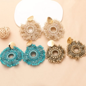 Bohemian style handmade woven seed bead earrings in gold, blue, and bronze colors