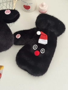 Detail of plush black snowman mittens with a red mini hat and snowflake embroidery