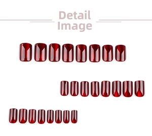 Detail view of deep red cat eye press-on nails in various sizes with glossy metallic finish