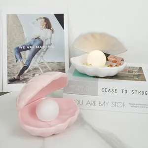 Elegant shell-shaped night light with glowing pearl for bedroom decor and jewelry storage