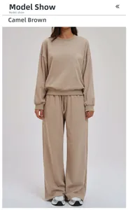 Detailed view of women's camel brown hoodie and high-waist drawstring wide-leg pants