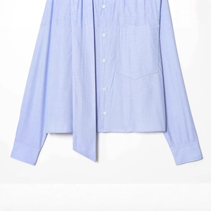 Light blue long sleeve shirt featuring a decorative neck tie and a large chest pocket