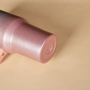 Close-up of the 40oz tumbler base featuring a pink glitter gradient and circular bottom