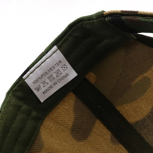 Detail shot of the inner care label showing 100% polyester fabric and washing symbols
