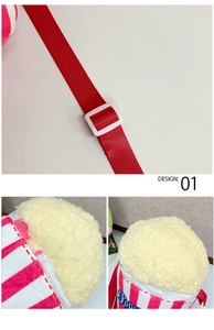 Detail view of plush popcorn bag featuring red stripes and yellow lamb wool textures