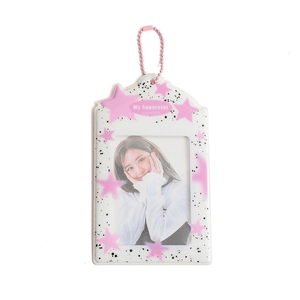 Detail of PVC photocard holder with pink star pattern and metallic ball chain accessory