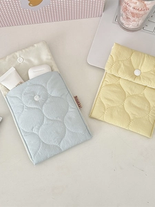 Quilted mini storage pouches in blue and yellow colors for small daily items