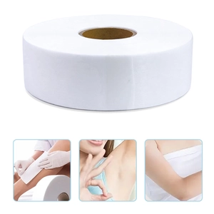 Macro detail of large roll white non-woven hair removal wax paper for body skin treatment