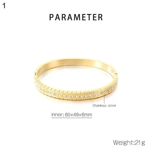 Detail view of 18K gold plated stainless steel heart bangle with dimensions 60x49x6mm