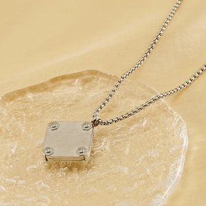 Industrial silver square anchor necklace with rivets and black agate on fabric