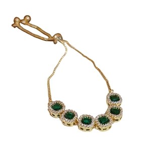 Elegant gold bracelet with five green square zircon stones and adjustable slide clasp