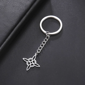 Polished stainless steel keychain with intricate Celtic knot hollow geometric pendant detail