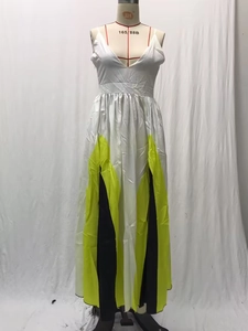 Detail of color-block pleated long dress with deep V-neck and geometric patchwork
