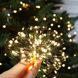 Warm white LED fairy lights with green wire for outdoor Christmas tree decoration