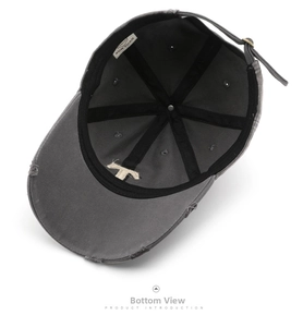 Internal view of a washed dark gray baseball cap showing reinforced seams and metal strap buckle