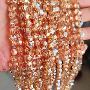 Macro shot of champagne gold faceted heart-shaped crystal glass beads for DIY jewelry
