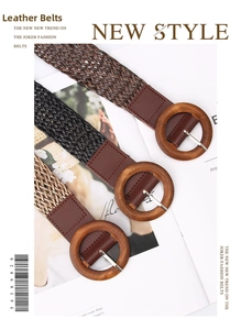 Detail of woven ethnic waist belts in black, brown, and khaki with round wooden buckles