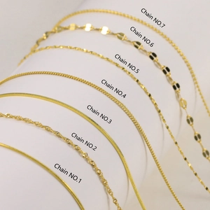 Selection of seven distinct gold-plated sterling silver chain styles on a white background